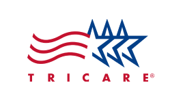 TRICARE logo featuring three red curved stripes and three blue stars above the word "TRICARE" in red capital letters on a white background, often seen at addiction centers in Nashville TN.